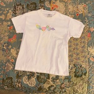 Tennis Anyone?? Girl’s white tennis shirt